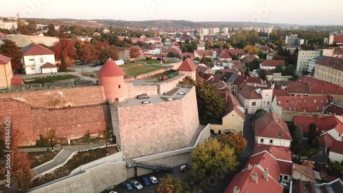 Cinematic 4K aerial drone shot of the old historic medieval Castle of Eger in the city of Eger, a major tourist destination in Northern Hungary, capital of Heves county photo
