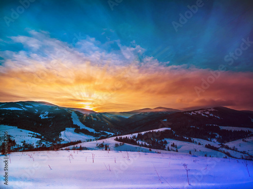Magnificent sunset in the winter mountains landscape. Carpathian, Ukraine