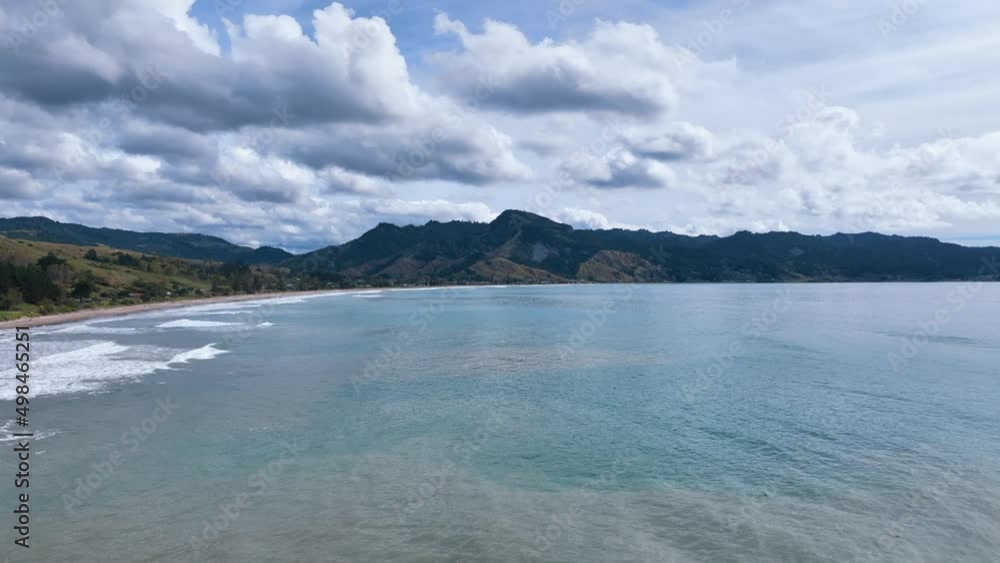 Fly over rocky outcrop and shallow waters towards Anaura Bay - New Zealand Fly over rocky outcrop and shallow waters towards Anaura Bay - New Zealand