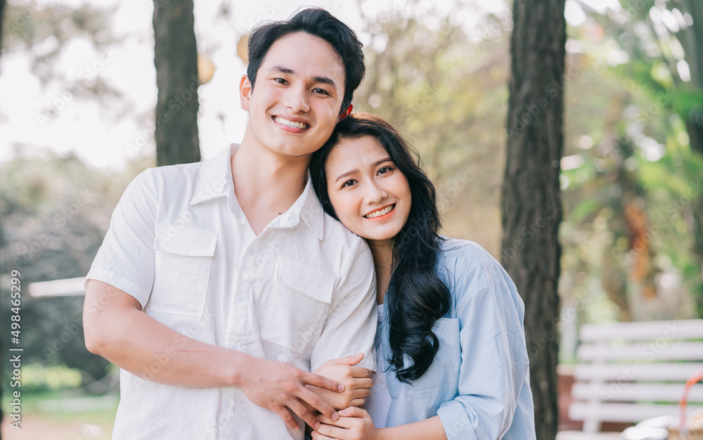 Fototapeta premium Portrait of young Asian couple outside