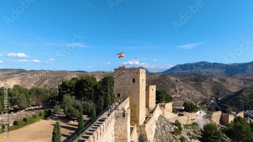 Wide view of Alcazaba in Antequera, Spain with people and landscape photo