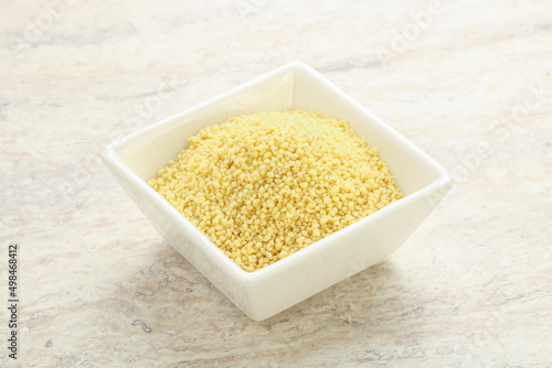 Raw couscous in the bowl