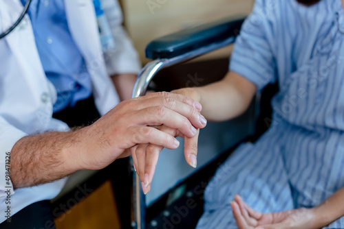 close up hand of doctor touching reassuring female patient. take care encourage patient. healthcare concept.