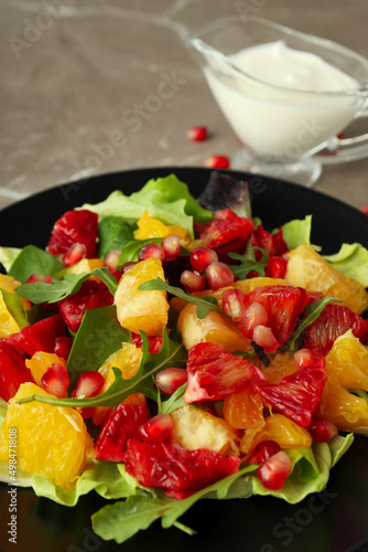 Concept of tasty food, salad with red orange, close up