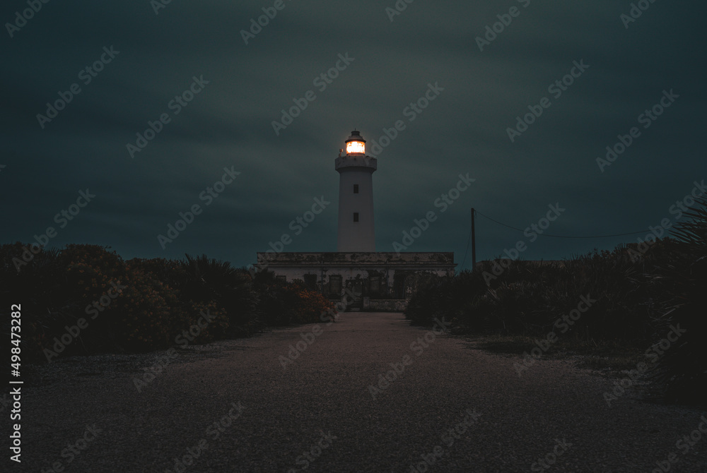 lighthouse in the cliff at dusk lighthouse in the cliff at dusk