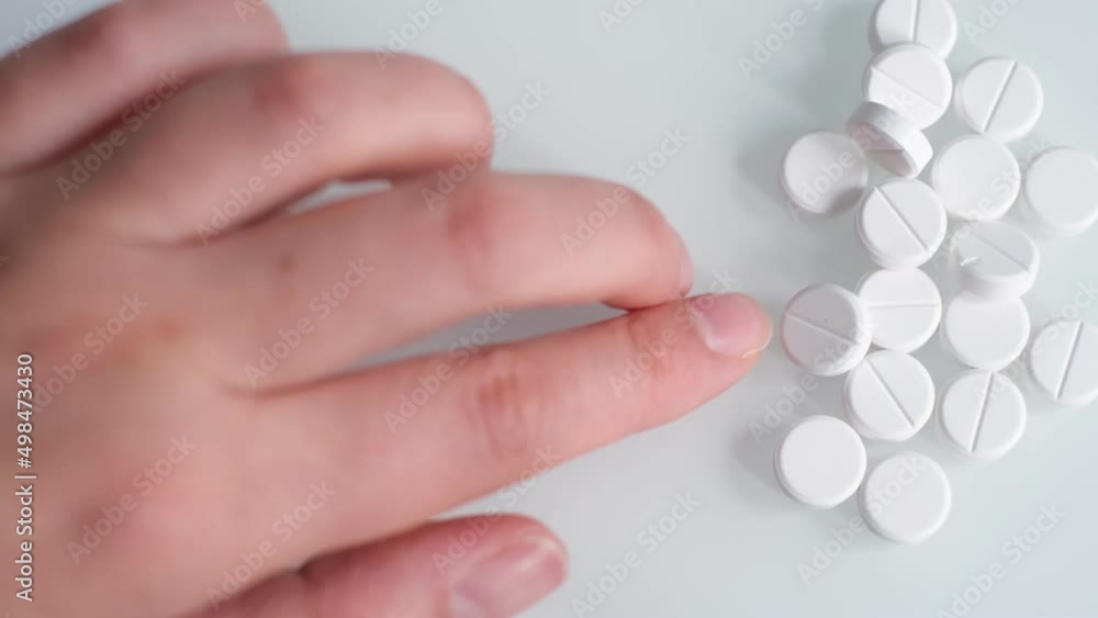 Holding painkiller pills on hand - pharmacy and treatment concept. Painkiller pill, Antibiotics pill, Muscle Dehydration pill, Swelling pill and Calcium tablet in the palm for spine subsidence. Holding painkiller pills on hand - pharmacy and treatment concept. Painkiller pill, Antibiotics pill, Muscle Dehydration pill, Swelling pill and Calcium tablet in the palm for spine subsidence.