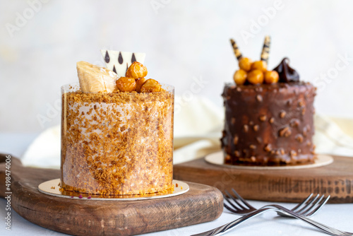 Types of cakes. Varieties of small cakes on a white background. Bakery products. Close-up.
