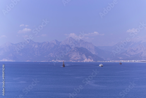 beautiful view from Kaleici castle, Antalya. blue sky and sea. boats are sailing © Birol