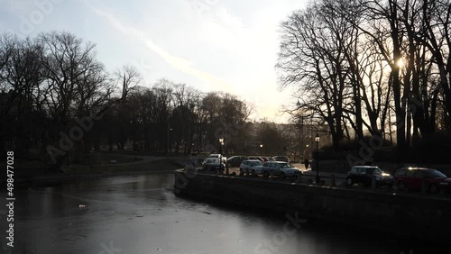 Gothenburg moat or Vallgraven at sunset in Göteborg, Sweden - Downtown Gothenburg of Västra Götaland County with water frozen in moat canal during winter at Sunset photo