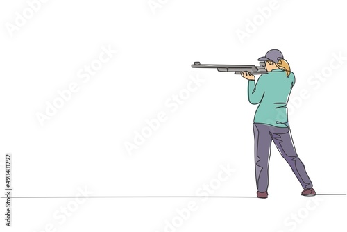 One single line drawing young woman practicing to shot target in range on shooting training ground vector graphic illustration. Clay pigeon shooting sport concept. Modern continuous line draw design