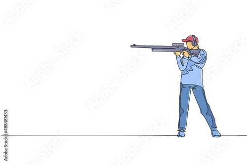 One continuous line drawing young man on shooting training ground practice for competition with rifle gun. Outdoor shooting sport concept. Dynamic single line draw graphic design vector illustration