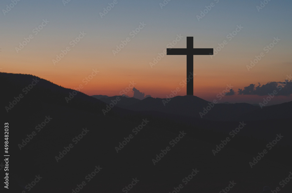 Cross of Jesus. Crucifix against the sky. Easter. Jesus has resurrected.