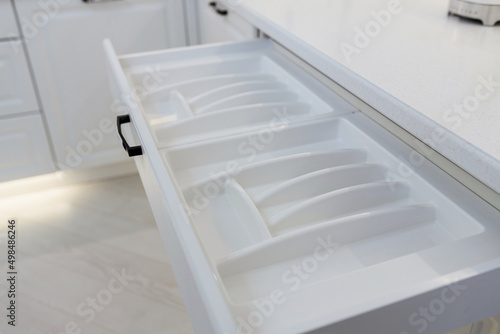 white box for utensils. side view