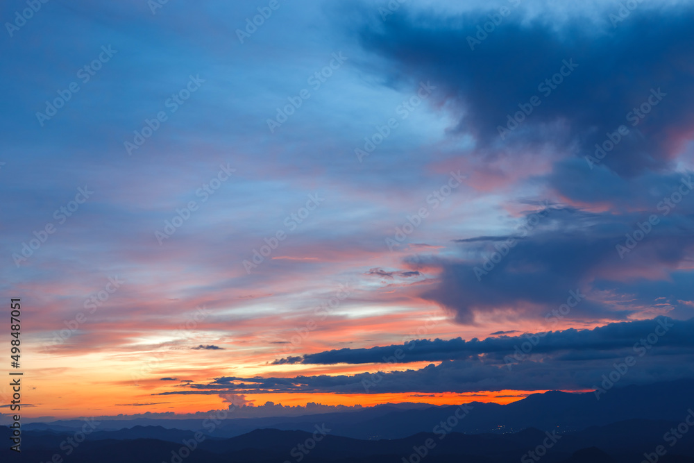 Colorful Cloudy sky At Sunset Dawn Sunrise. Sun Over Skyline,