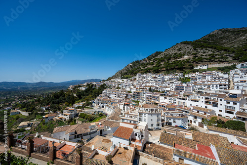 Traditional Spanish white washed houses mountain view of town Mijas