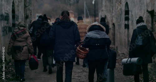 Refugees Migrating In Cold During War Crisis. photo