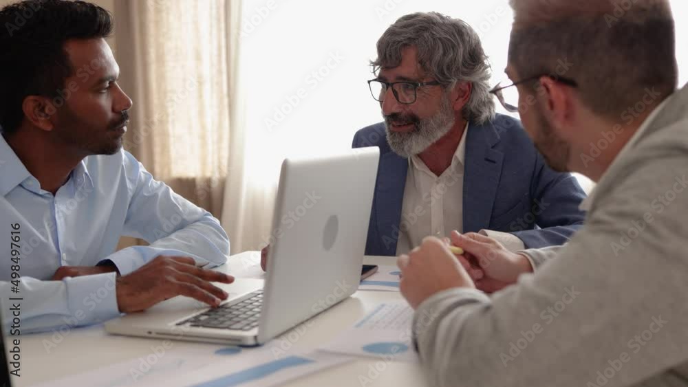 Multi-ethnic and generational business people working together inside bank office Multi-ethnic and generational business people working together inside bank office