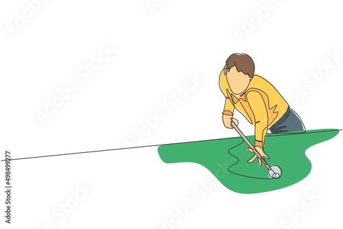 One continuous line drawing of young handsome man focus aiming before hit the pool billiard balls with stick. Tournament indoor sport game concept. Dynamic single line draw design vector illustration