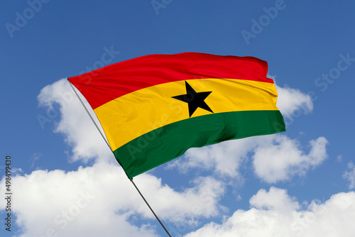 3d illustration. A beautiful view of Gana flag on a sky background.