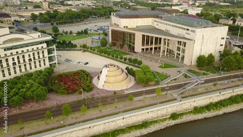 Cinematic 4K aerial drone dolly in shot of Ziggurat, the National Theatre, Ludwig Museum, Ferencvaros neighborhood, Mupa, Bajor Gizi park with the Danube river, bridges in Budapest, Hungary photo