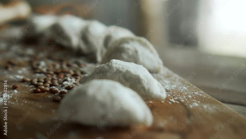 Russian fresh handmade dumplings lying on the wooden table on the cutting board Russian fresh handmade dumplings lying on the wooden table on the cutting board