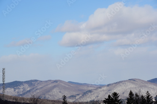 Mountain peaks Killington Vermont ski resort with puffy clouds