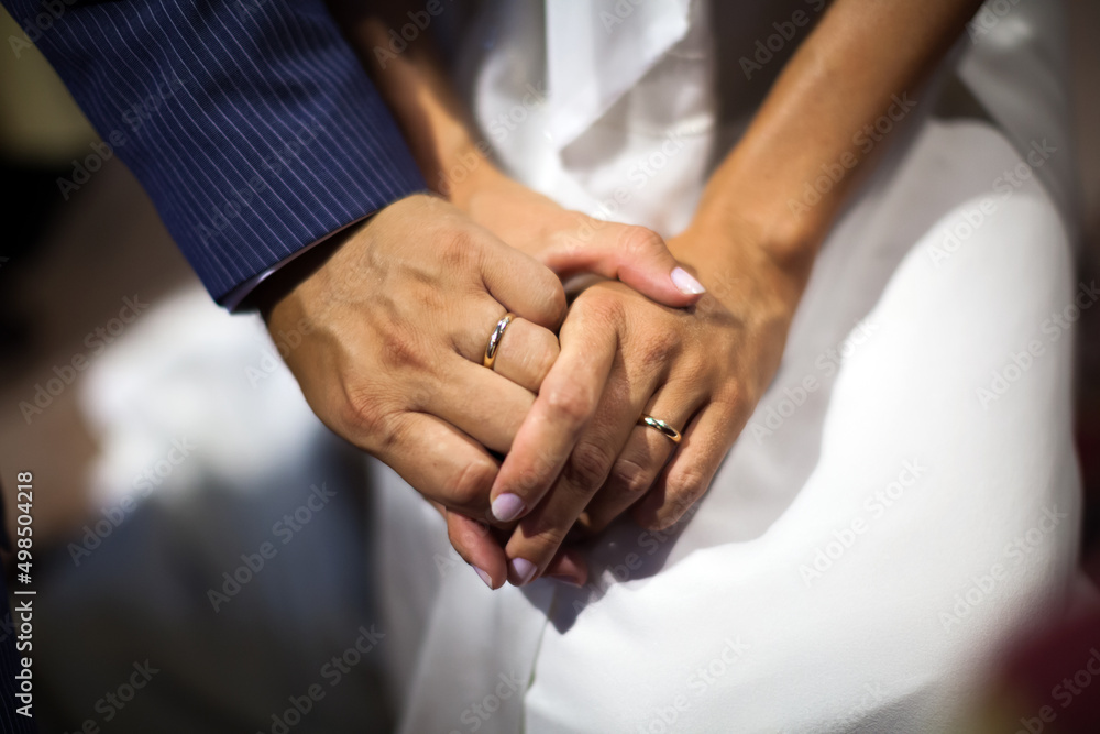 Wedding Love For for Life - Groom and Bride holding hands with Wedding Rings on close up Wedding Love For for Life - Groom and Bride holding hands with Wedding Rings on close up