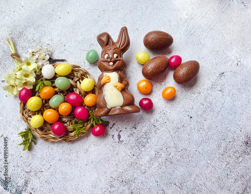 Chocolate Easter Eggs ,Rabbit and Colorful Easter Candy  .Easter Greeting Card