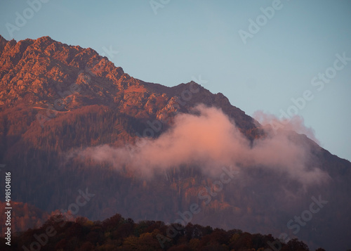 a colorful sunset on top of utumn mountain photo