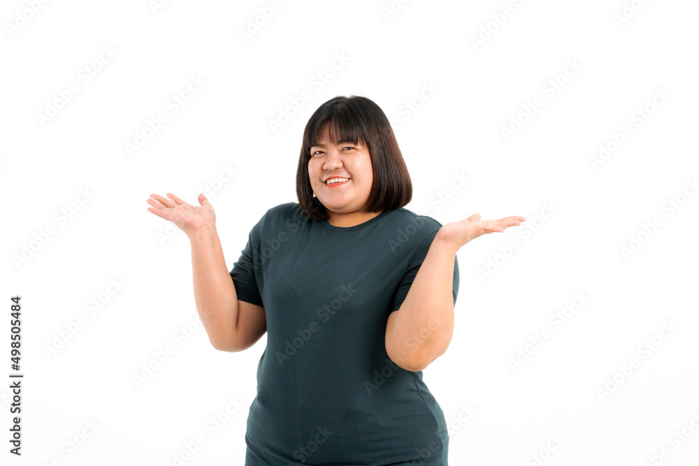 Portrait of a plump girl wearing a gray t-shirt feels like enjoying her lifestyle on a white background. Selective focus. Portrait of a plump girl wearing a gray t-shirt feels like enjoying her lifestyle on a white background. Selective focus.