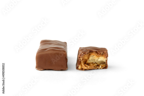 Chocolate sweets with caramel and crackers isolated on white background.
