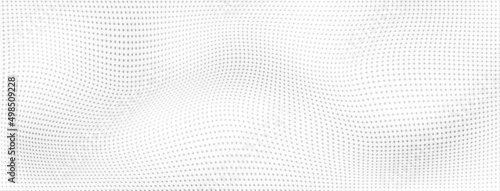 Abstract halftone background with curved surface made of small dots in white and gray colors
