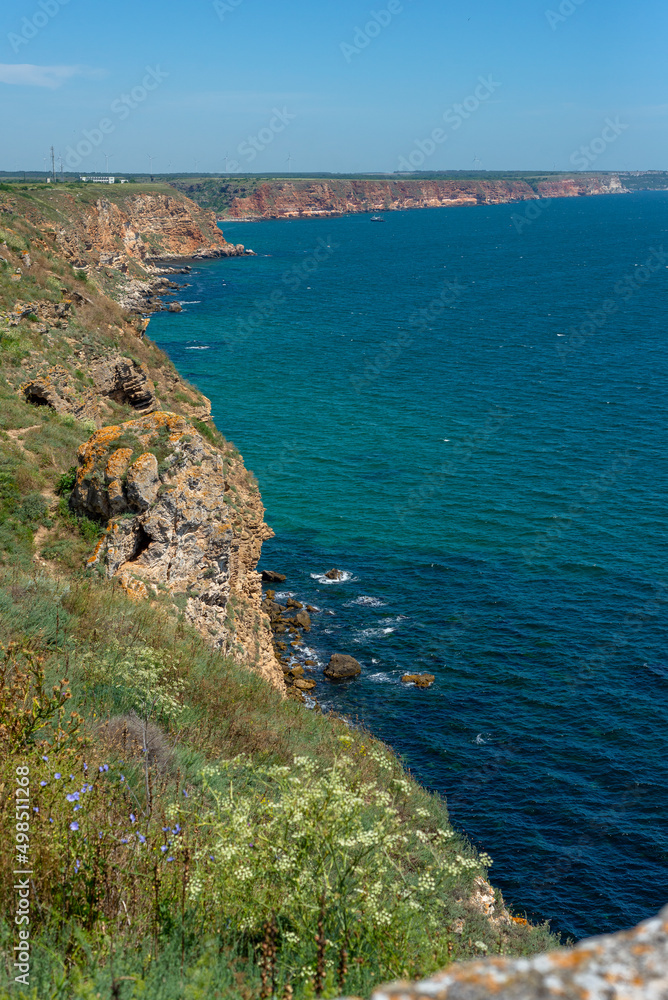 Vertical photo. Seascape. View from the cliff. Ocean and nature.