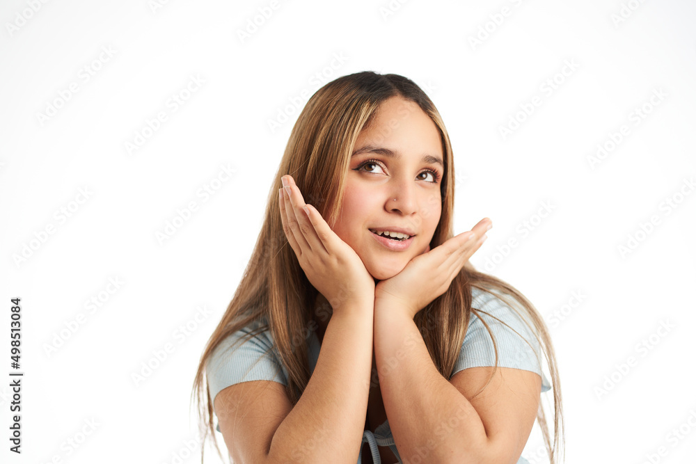 Young sweet smiling girl with her hands on her face Young sweet smiling girl with her hands on her face