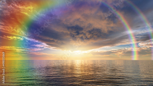 Beautiful landscape with turquoise sea, double sided rainbow in the background at amazing sunset 