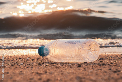 Trash bottles at the beach. garbage and pollution concept