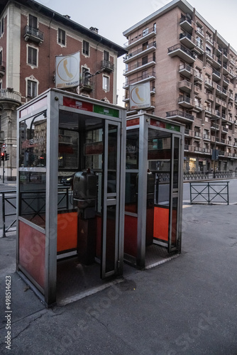 Fototapeta Naklejka Na Ścianę i Meble -  TURIN, ITALY - August 21, 2021: Telephone booth view on the streets of Turin