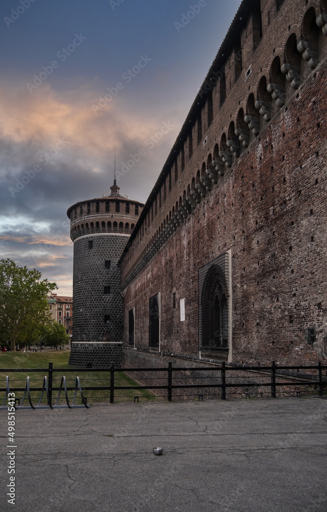 Outer wall of the Sforza's Castle (Castello Sforzesco) and a corner tower on a cloudy day