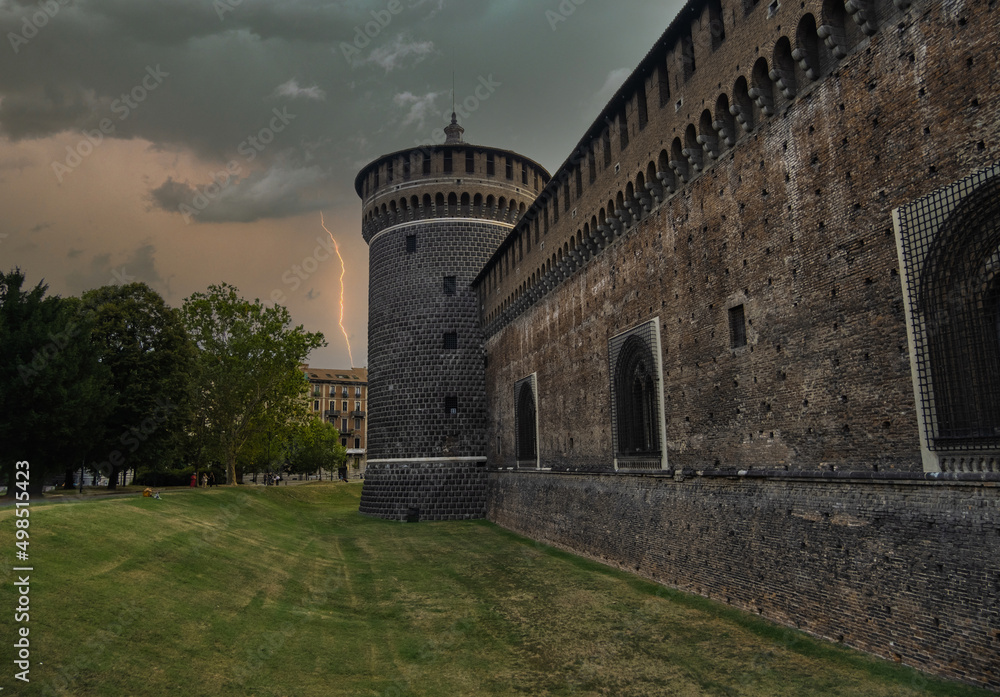 Outer wall of the Sforza's Castle (Castello Sforzesco) and a corner tower on a stormy day