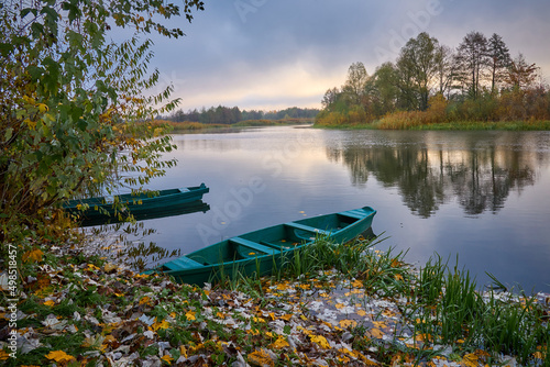 Obraz na plátně Two boats are on the river in the morning in Ukraine