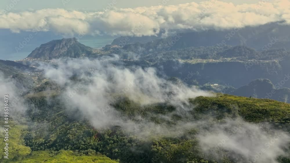 Aerial view of great morning in mountains of Madeira island . Flying over green mountains and clouds at Pico Ruivo, Madeira. UHD, 4K Aerial view of great morning in mountains of Madeira island . Flying over green mountains and clouds at Pico Ruivo, Madeira. UHD, 4K