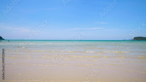 4K Background Footage of tropical asian beach, sea, sand and blue sky in summer day. Taken in Thailand which many of famous beach in Krabi, Phuket and Pattaya.