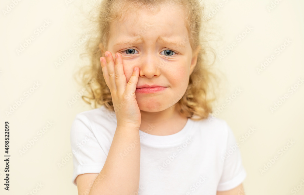 The child has a toothache. Children's caries in the initial stage. The child has a toothache. Children's caries in the initial stage.