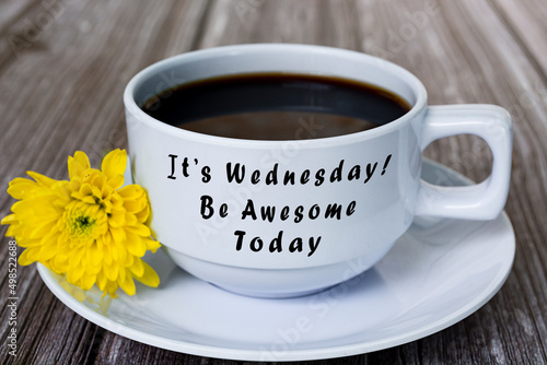 Canvas-taulu Text on white coffee cup with yellow flower on wooden desk
