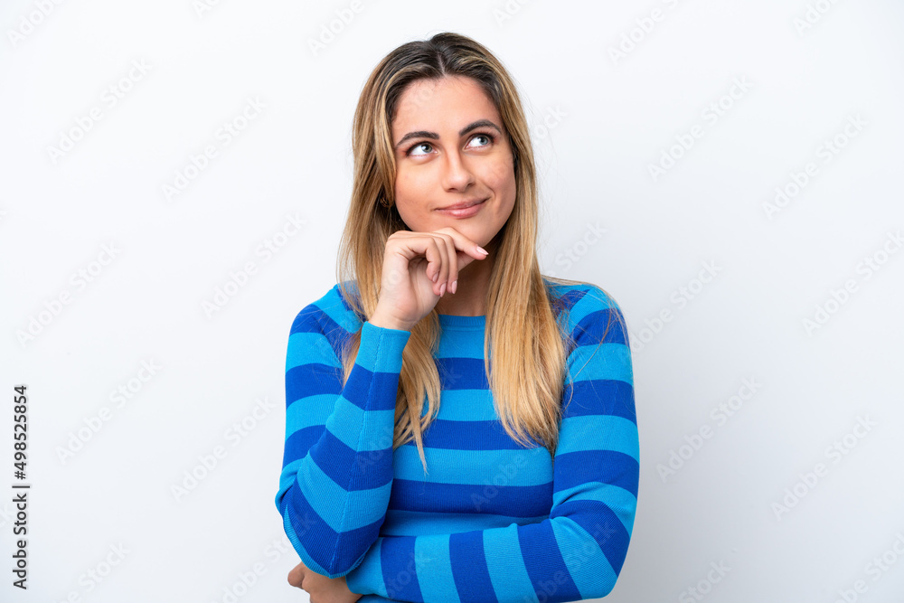 Fototapeta premium Young caucasian woman isolated on white background having doubts and thinking