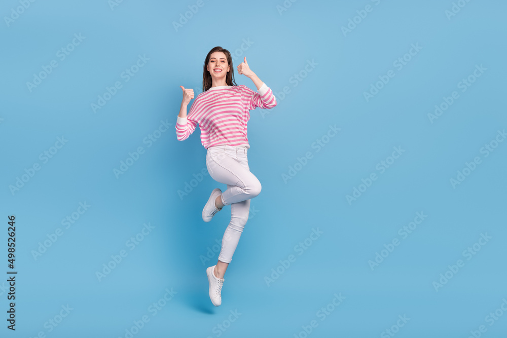 Full body photo of active satisfied person two hands demonstrate thumb up isolated on blue color background