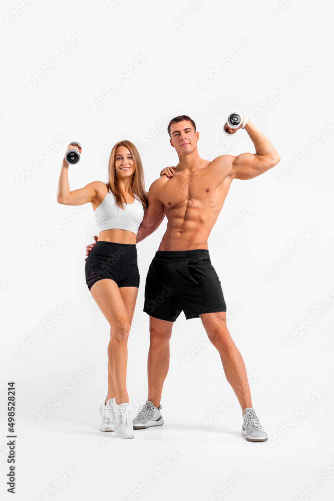 Fit couple at the gym isolated on white background. Fitness concept.  Healthy life style. Fitness-Related Materials for Your Social Media  Marketing Campaigns Stock Photo