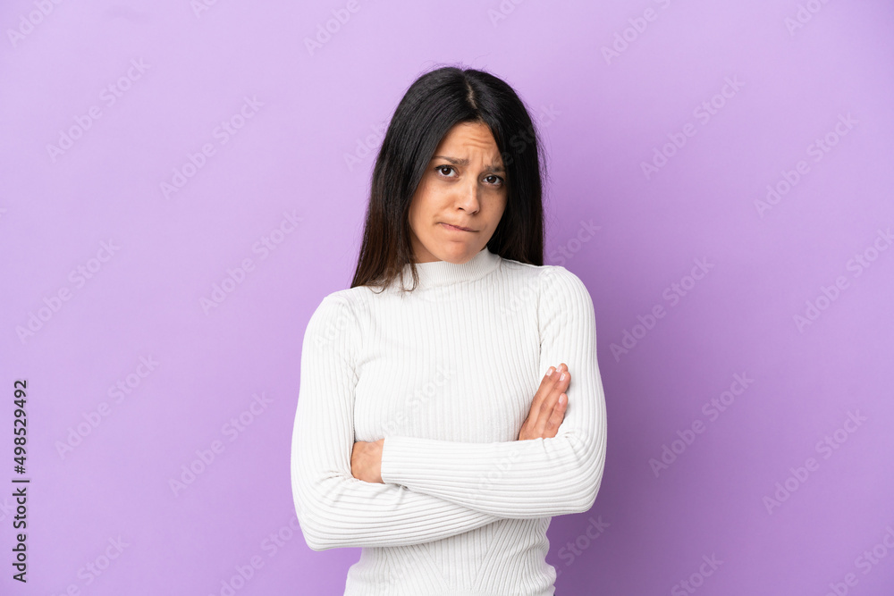 Young caucasian woman isolated on purple background with unhappy expression Young caucasian woman isolated on purple background with unhappy expression