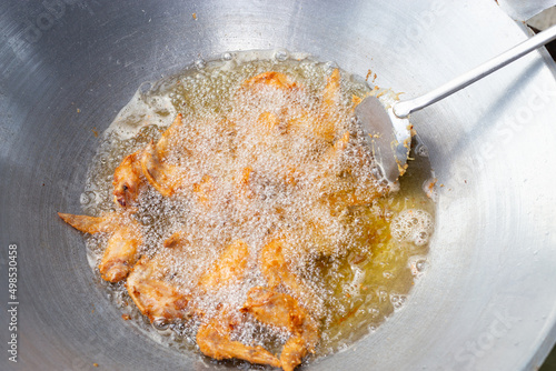 Top view Fried chicken wings in a pan with hot oil