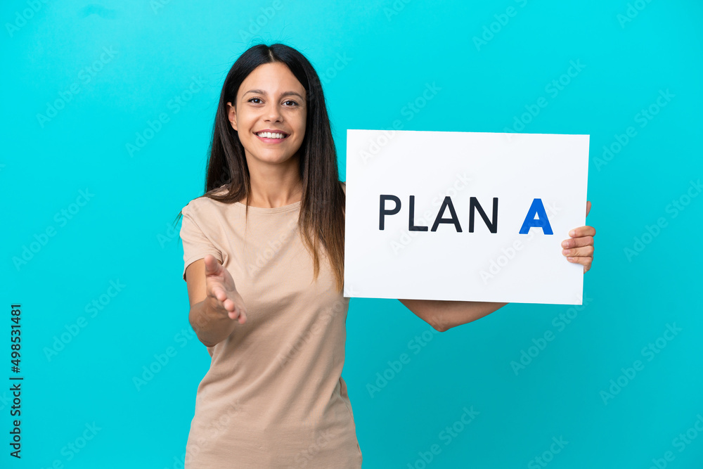Young woman over isolated background holding a placard with the message PLAN A making a deal Young woman over isolated background holding a placard with the message PLAN A making a deal
